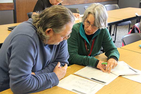 Faculty working with student on assignment