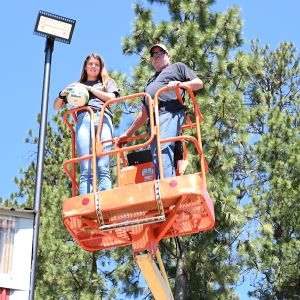 Jestine Lackner installing a light