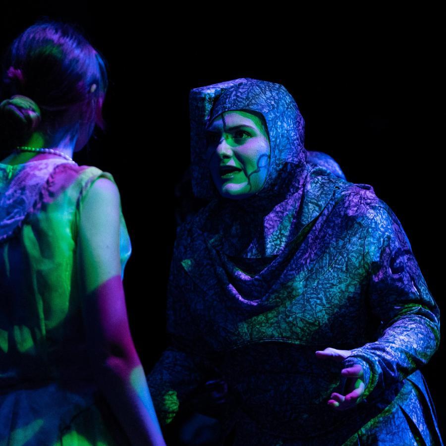 Eurydice Play, 2 female actors on stage acting under green and blue lights