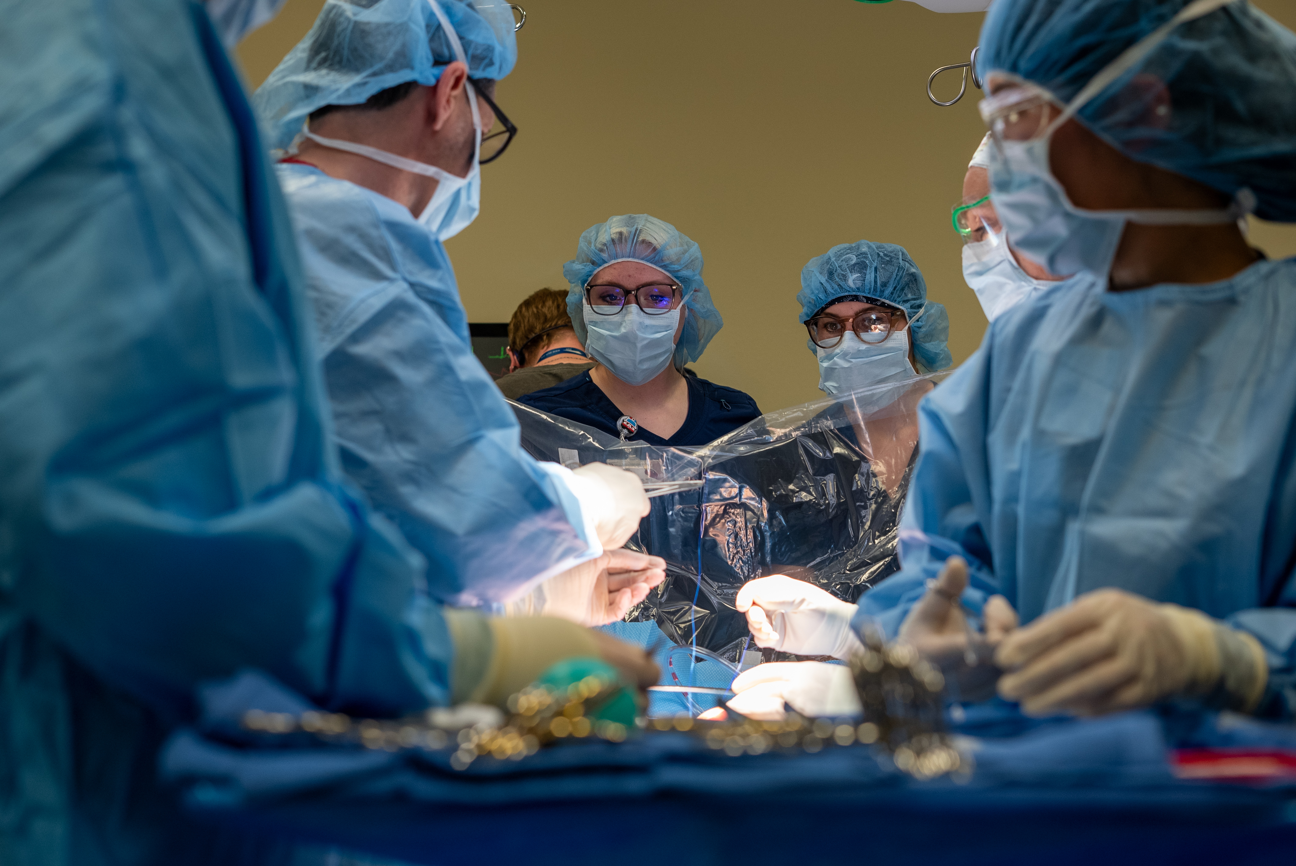Surg Tech mock surgery with multiple people at the surgery table
