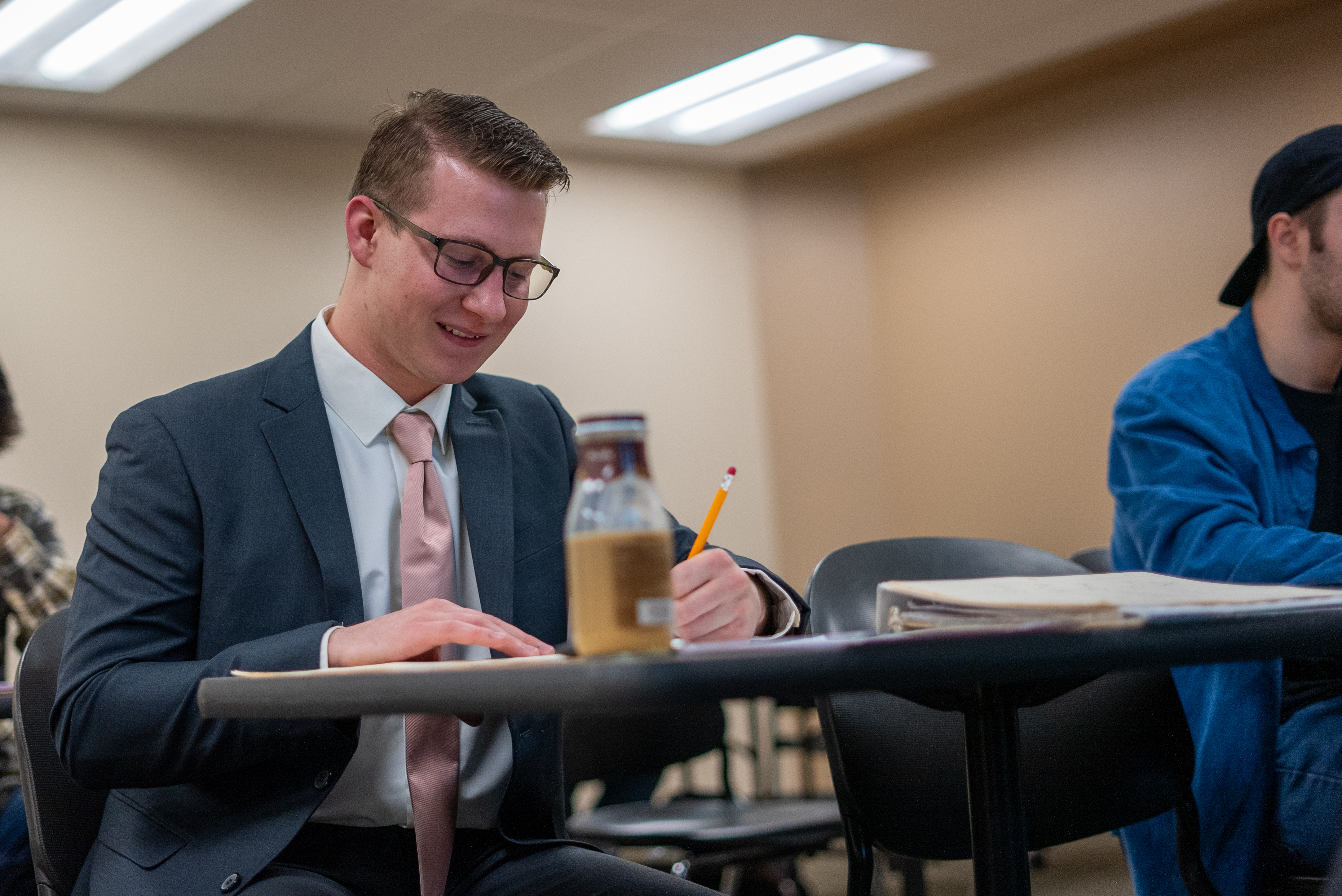 Student in suit taking test