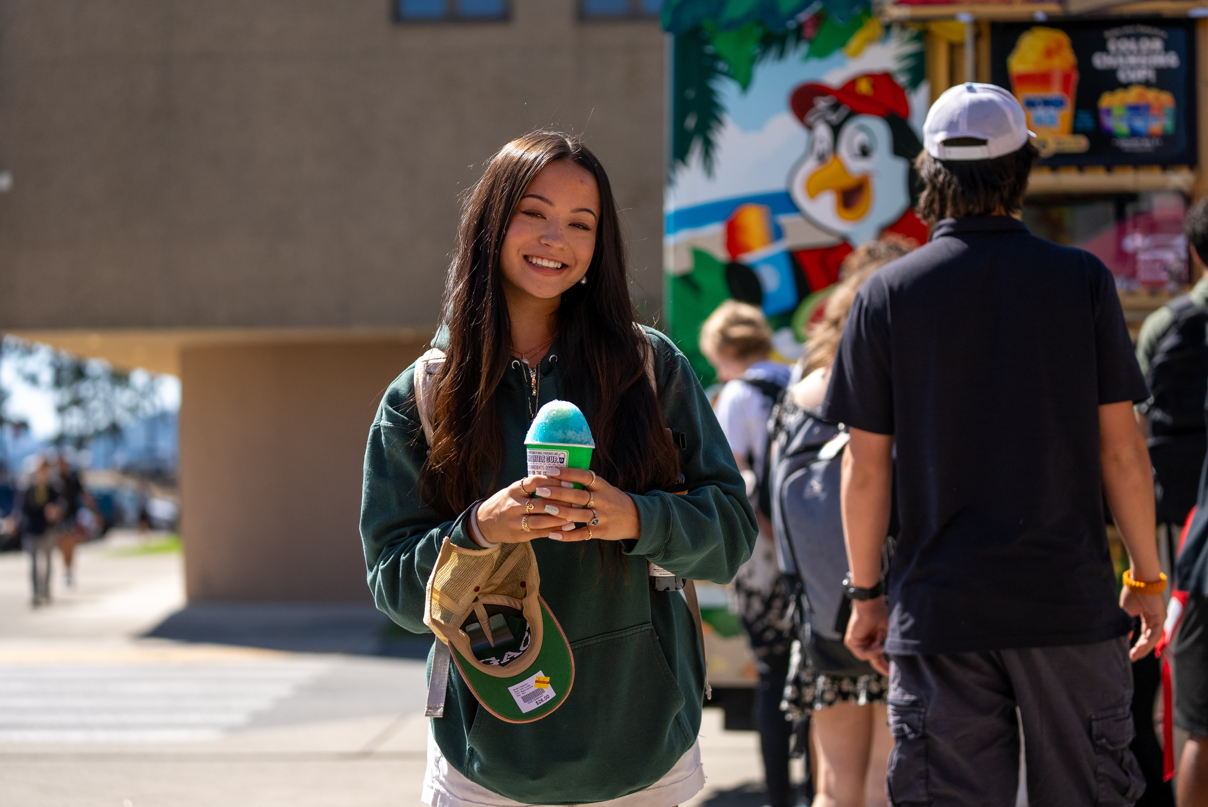 Student on First day of School holding a snow cone