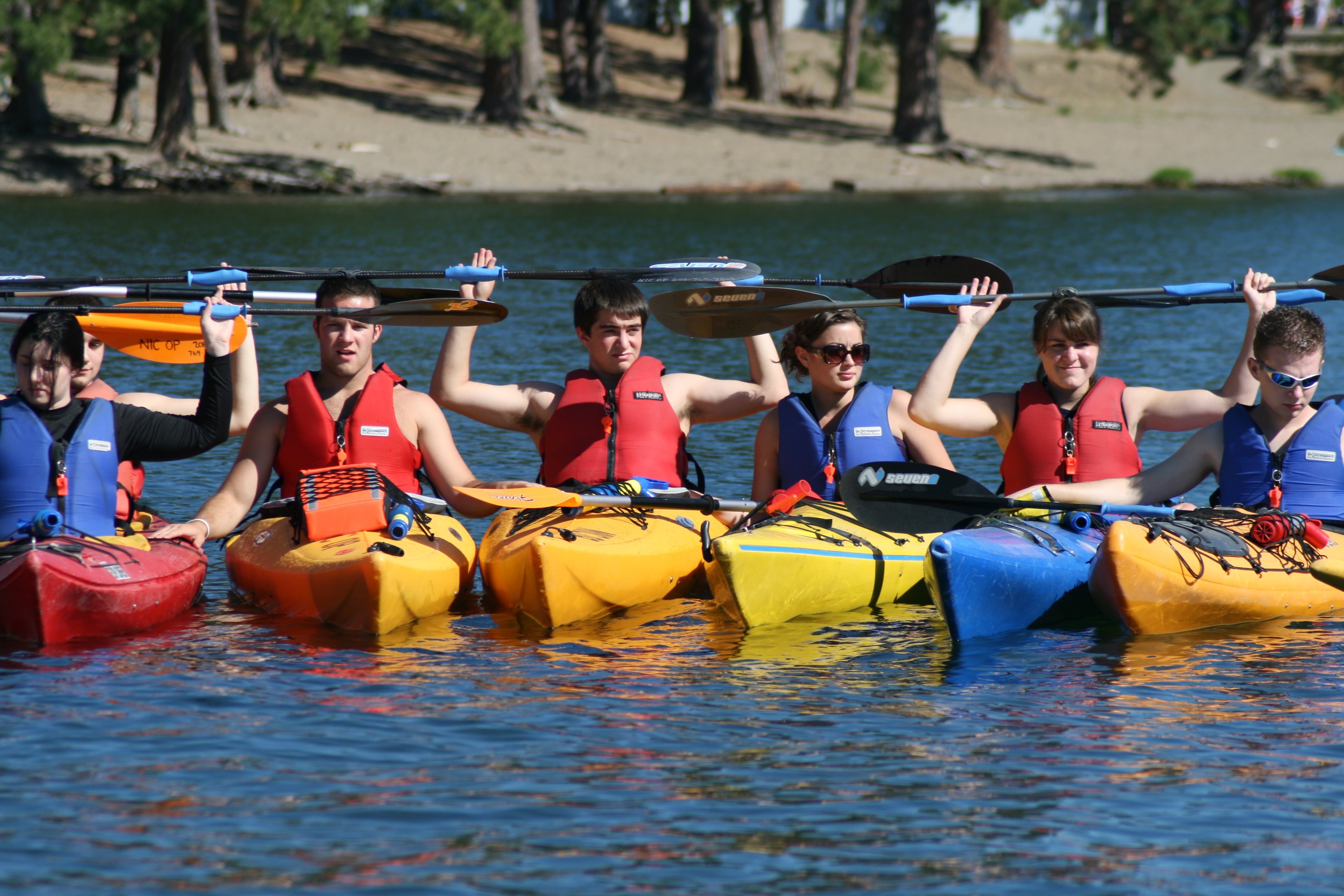 Students Kayaking posing in a line for photo