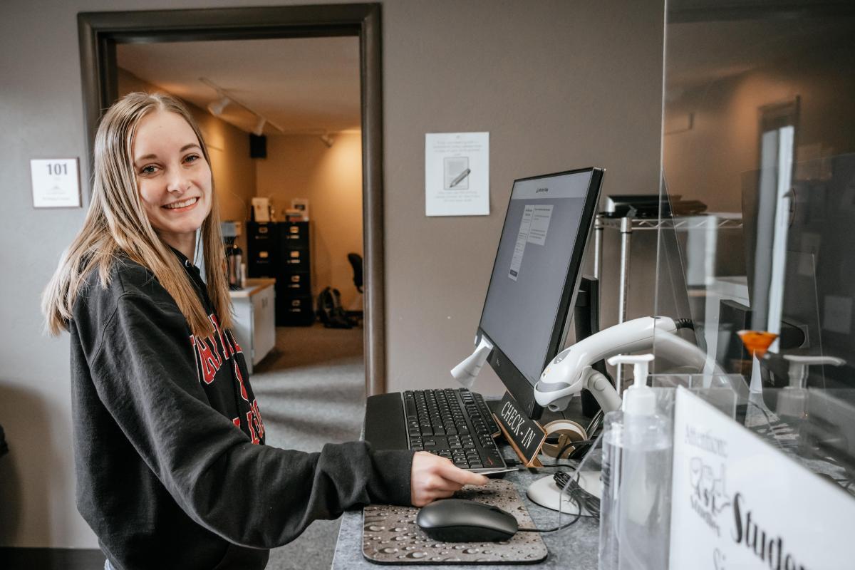 1200x800 Student at Writing Center on a standing at a computer