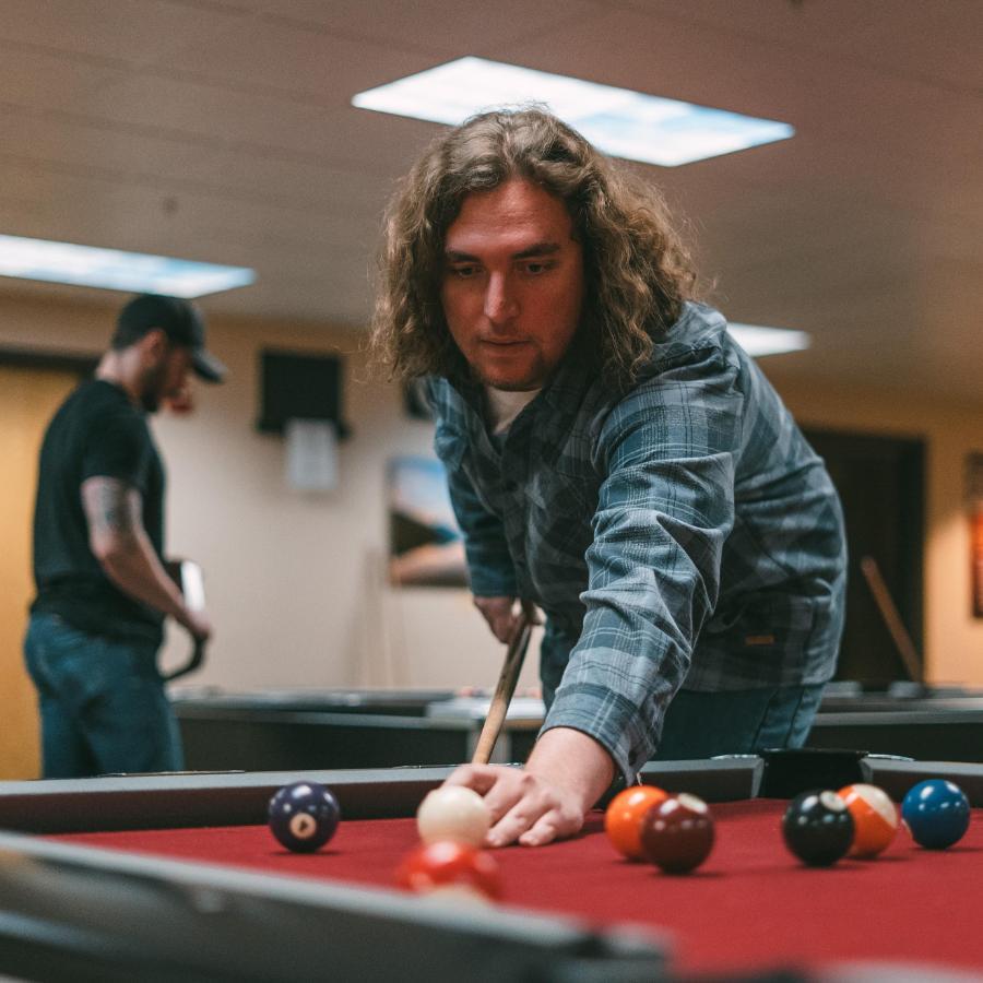 900x900 Male Student in Sub playing pool in the activity center