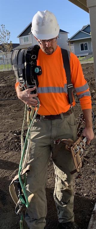 Chris Howard at work as a telecom lineman.