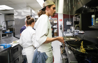 Culinary students cooking in the kitchen