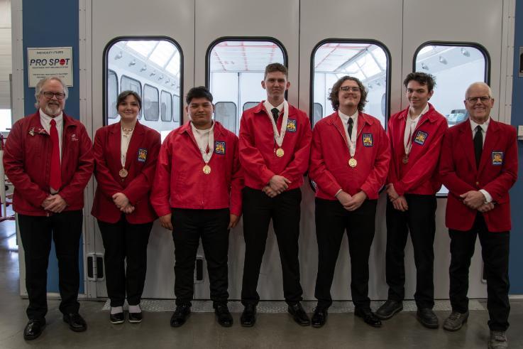 From left, NIC Autobody Advisor AJ Parker, Auto Refinishing bronze medalist Jazzy Bicknell, Collision Damage Appraisal gold medalist Onasis Ocampo Mendoza, Collision Repair gold medalist Jon Brunko, Auto Refinishing gold medalist Koby Garvin Carrasco, Collision Repair bronze medalist Sydney Beamis and NIC Autobody and Paint Technology Instructor Cal DeHaas pose for a photo.  