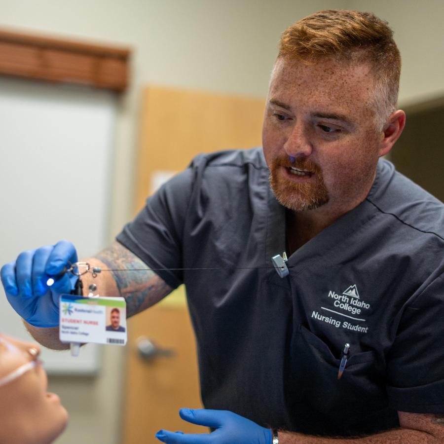 Male Vetran pursing a nursing degree in nursing lab