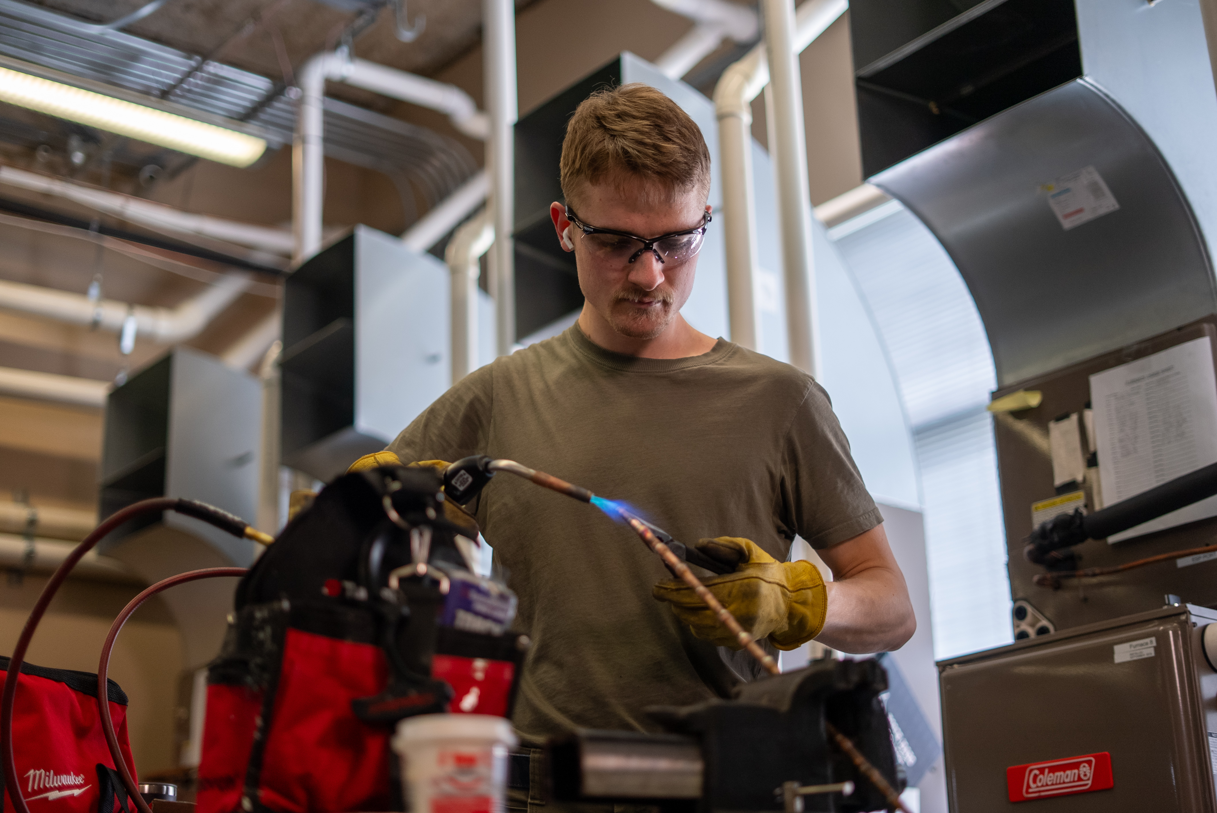 HVAC Class two male students working on hvac system