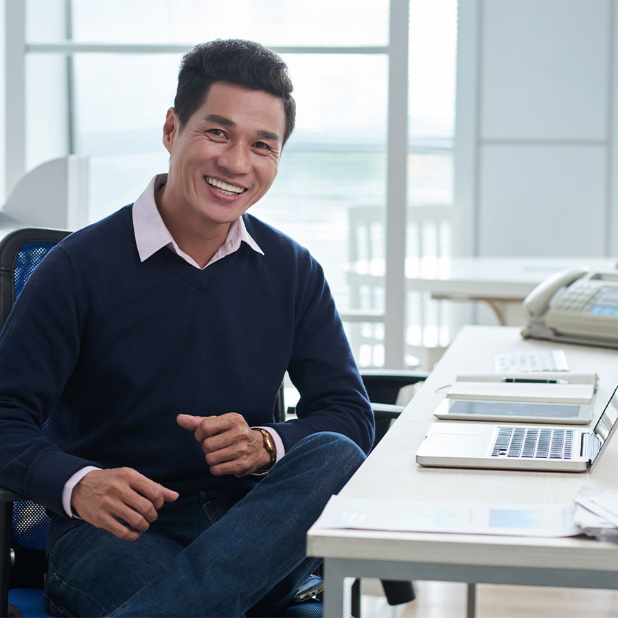 Man sitting at desk in front of computer