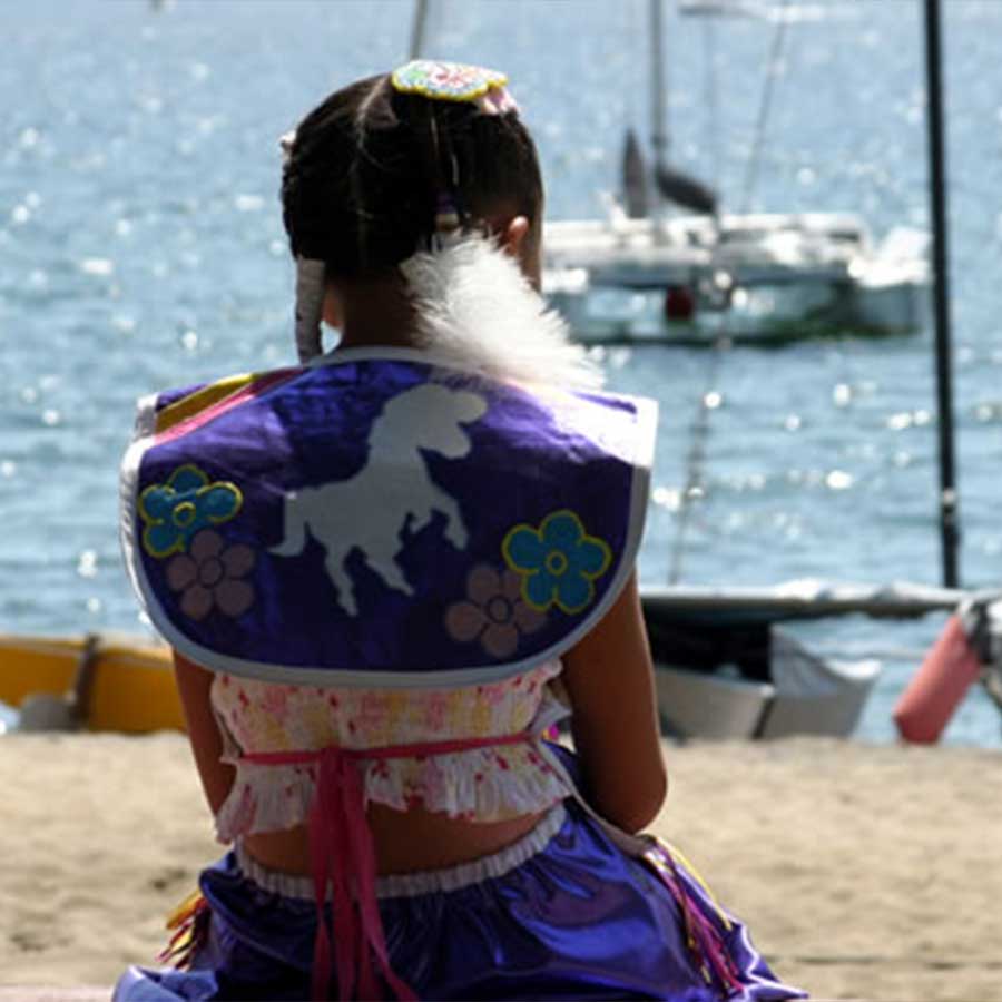 Women in native America Clothing overlooking the lake