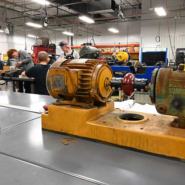 Students working in the Industrial Mechanic Shop