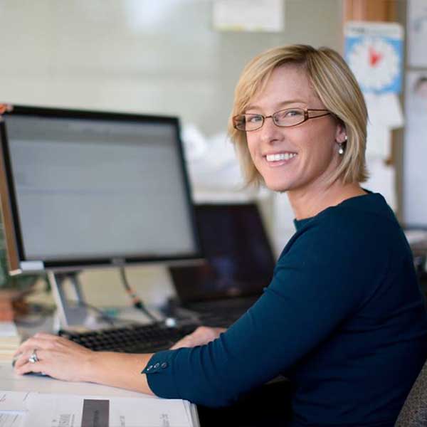 Medical Administrative Assistant working at her desk