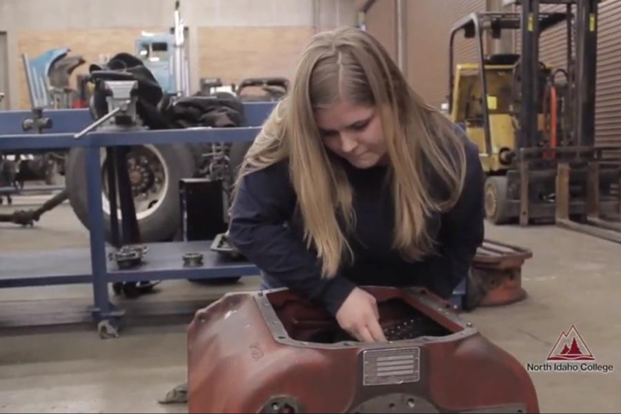 Girl working on an engine