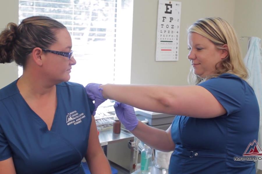 Medical Assistant student administering a shot