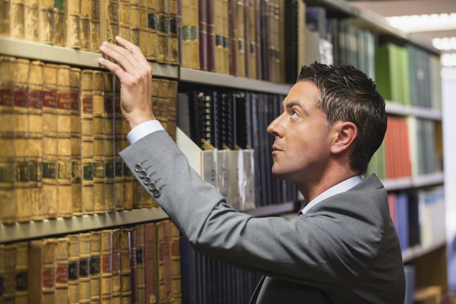 Paralegal man in library