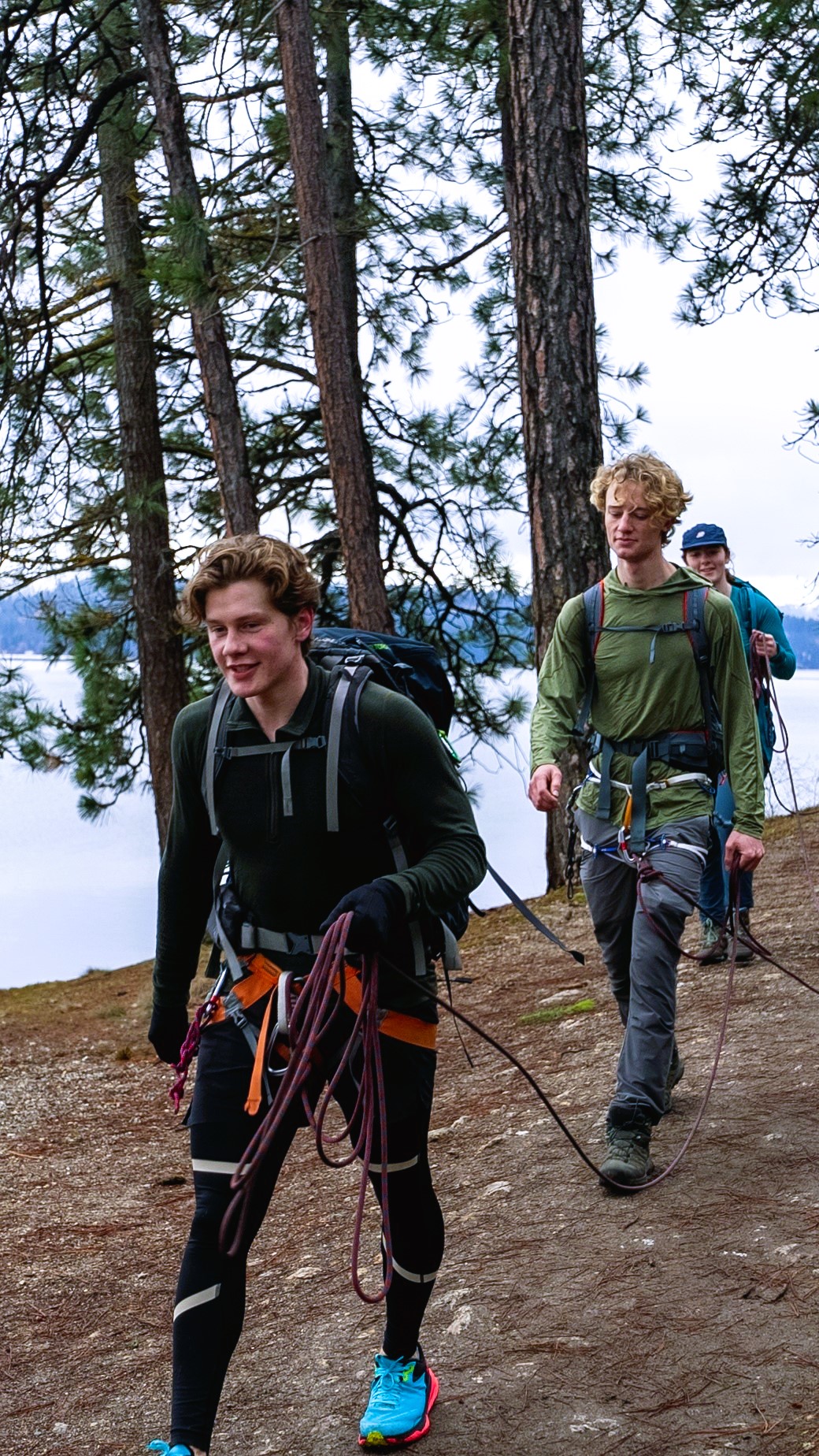 Three students hiking along Lake CdA
